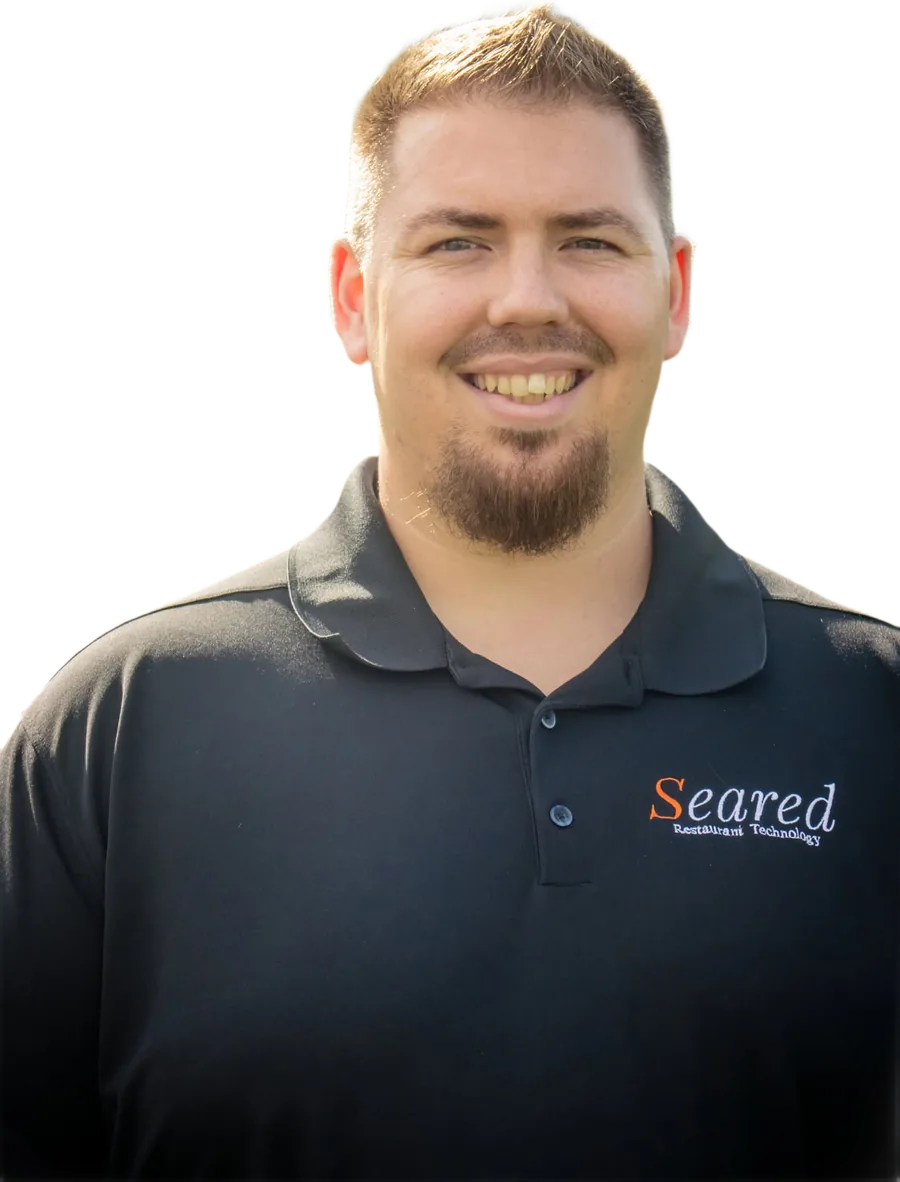 Chad Tennent, who built InstaBuild, smiling in a dark polo shirt